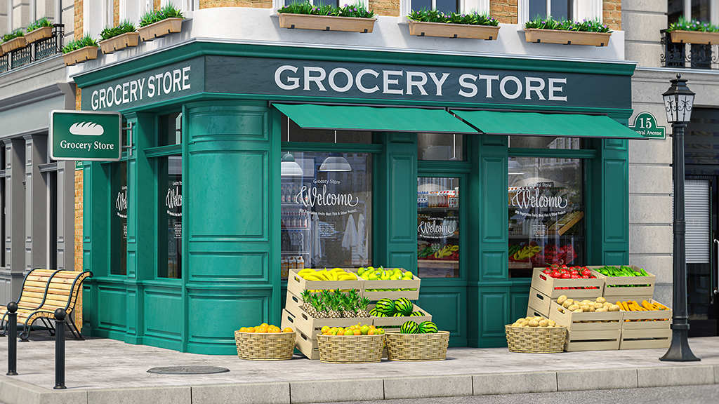 A grocery store on a street corner with crates of fruits and vegetables in front