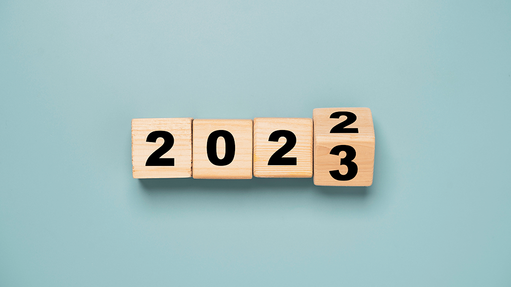 Wooden blocks with 2022 prepare to turn to 2023